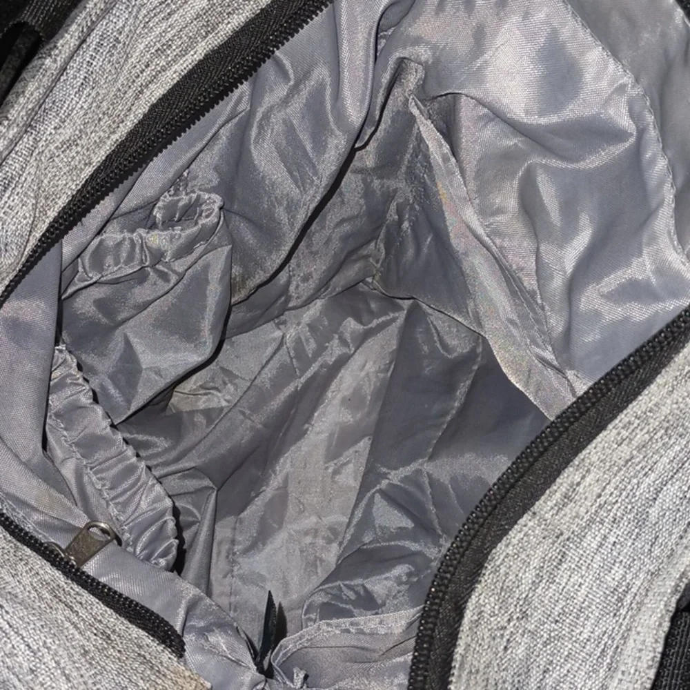 Eddie Bauer diaper bag with many compartment including insulated side pocket